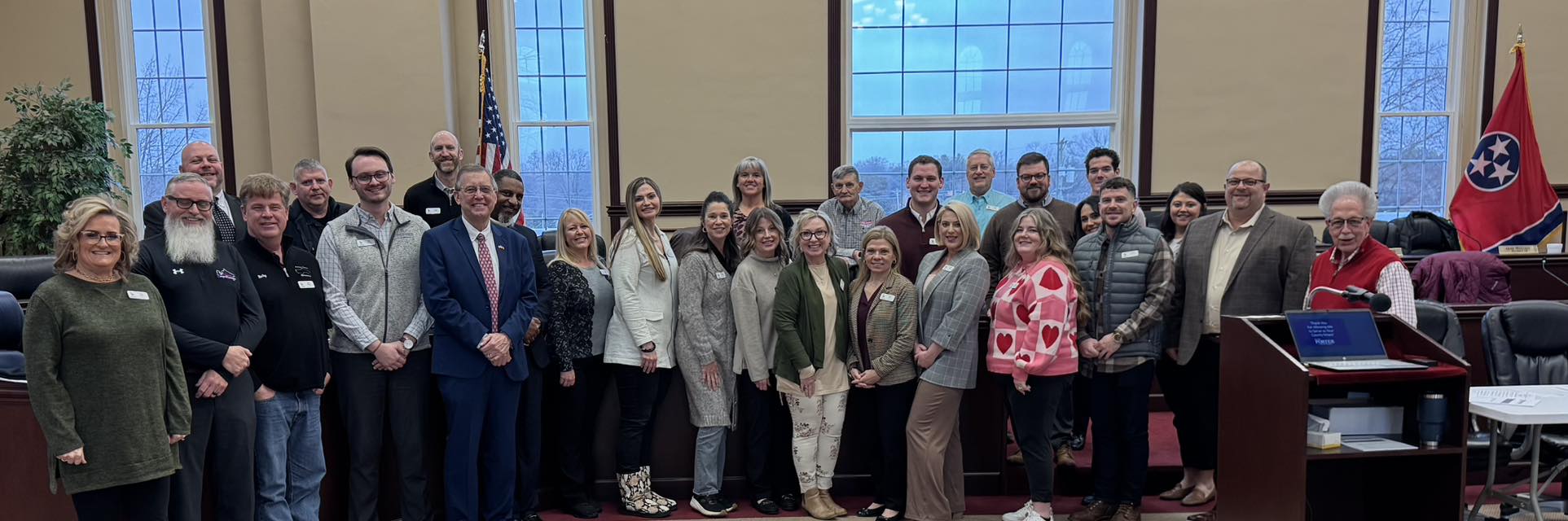 Jamie Hunter with community members and officials in the Putnam County chambers